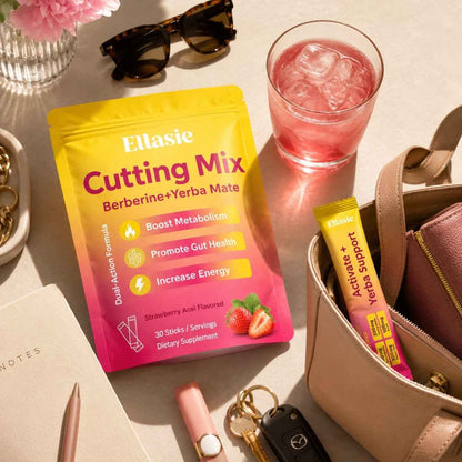 Ellasie Cutting Mix dietary supplement pouch in yellow and pink packaging, styled on a beige tabletop with sunglasses, a pink drink, a handbag, keys, and other lifestyle props.